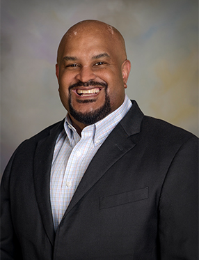 Carlos Naylor headshot.